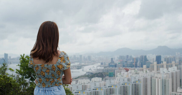 Woman look at the city view from mountain