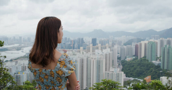 Woman look at the city view from mountain