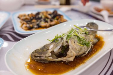 Fresh steamed fish served on plate
