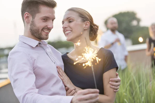 Smiling Young Businessman Businesswoman Holding Sparkler — Stock Photo, Image