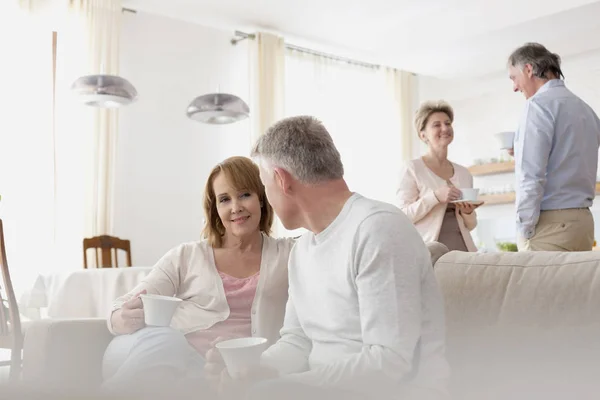 Mature Couples Talking Living Room Home — Stock Photo, Image