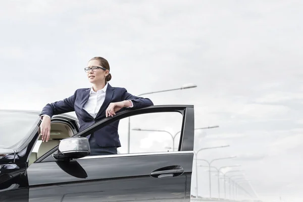 Confident Businesswoman Standing Open Car Door Sky — Stock Photo, Image