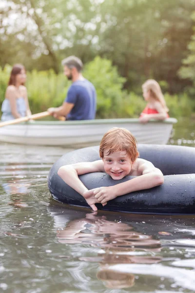 Portrait Smiling Boy Floating Inflatable Ring Lake Family — Stock Photo, Image
