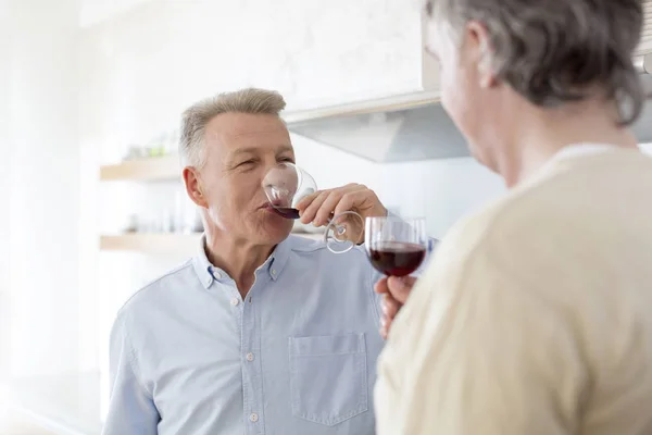 Mature Men Drinking Wine While Standing Home — Stock Photo, Image