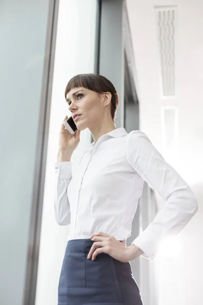 Businesswoman Talking Smartphone While Standing Window Office — Stock Photo, Image