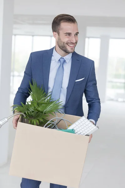 Smiling Handsome Young Businessman Standing Cardboard Box New Office — Stock Photo, Image