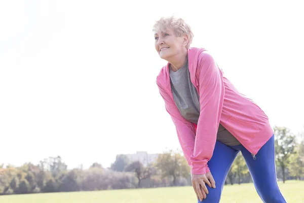 Senior Woman Wearing Jacket While Exercising Park — Stock Photo, Image