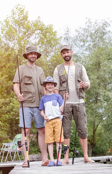 Full Length Portrait Smiling Males Standing Fishing Rods Pier Trees — Stock Photo, Image
