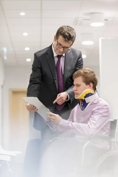 Doctor Explaining Document Disabled Patient Wheelchair Hospital — Stock Photo, Image