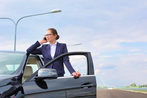 Businesswoman Talking Smartphone While Standing Car Road — Stock Photo, Image