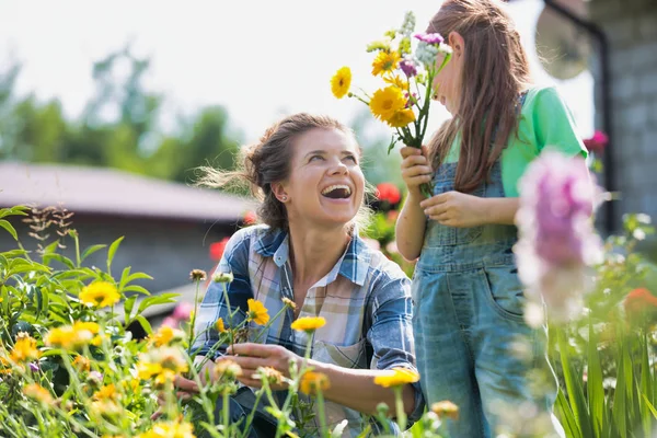 Smiling Mother Daughter Looking Flowers While Gardening Farm — Stock Photo, Image