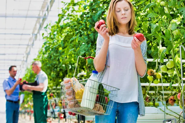 Woman Smelling Fresh Tomato Greenhouse — Stock Photo, Image