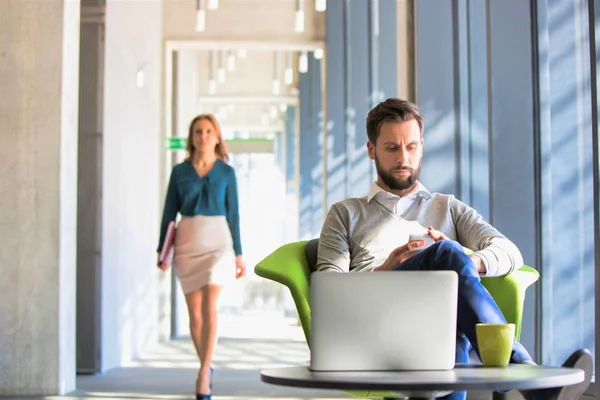 Bearded Businessman Using Smart Phone Whilst Sitting Green Chair Office — Stock Photo, Image