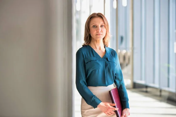 Senior Business Woman Holding Office Whilst Reading Files — Stock Photo, Image