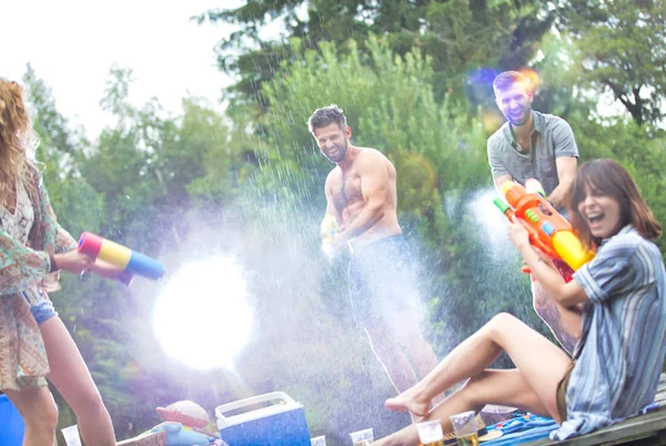 Cheerful Couples Enjoying Water Guns Pier Summer — Stock Photo, Image