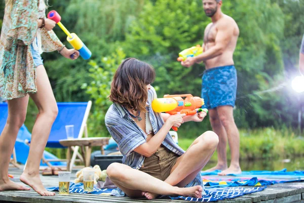 Cheerful Couples Enjoying Water Guns Pier Summer — Stock Photo, Image