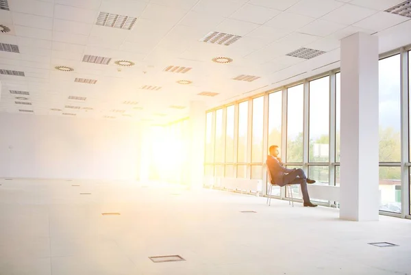 Full Length Thoughtful Young Businessman Sitting Chair While Looking Window — Stock Photo, Image