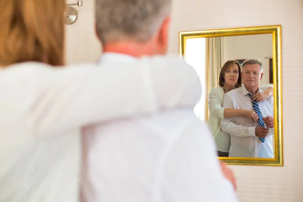Mature Woman Adjusting Necktie Businessman While Looking Mirror Home — Stock Photo, Image