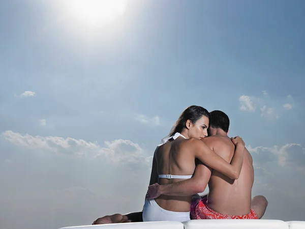 Young Couple Embracing Cushions Outdoors Back View — Stock Photo, Image