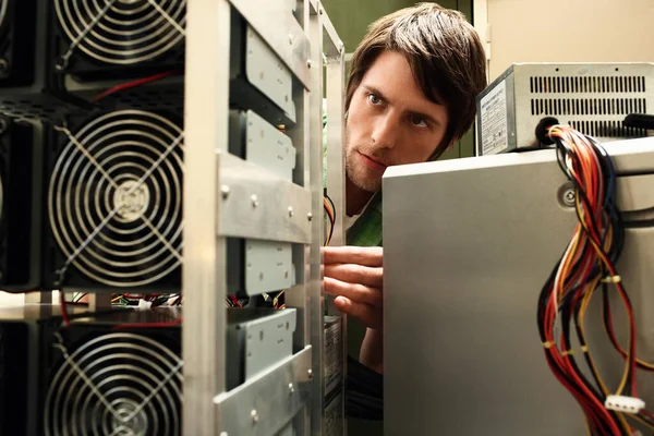 Young Man Fixing Computer Equipment — Stock Photo, Image