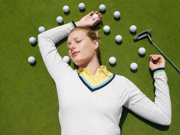 Young Woman Lying Green Surrounded Golf Balls View — Stock Photo, Image