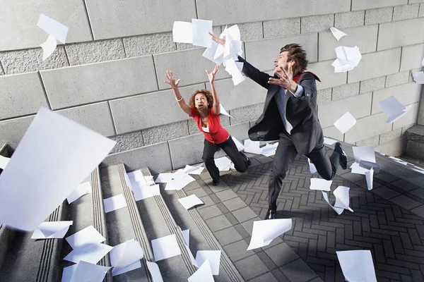 Busines Man Woman Catching Falling Paperwork Steps — Stock Photo, Image