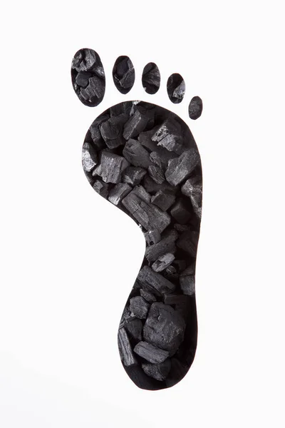 Carvão Visto Através Folha Papel Com Forma Corte Pegada — Fotografia de Stock