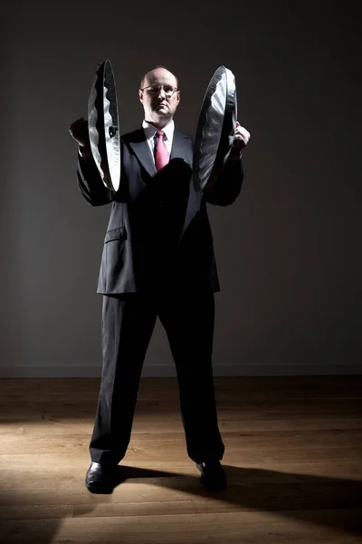 Man Full Suit Holding Two Garbage Can Lids — Stock Photo, Image