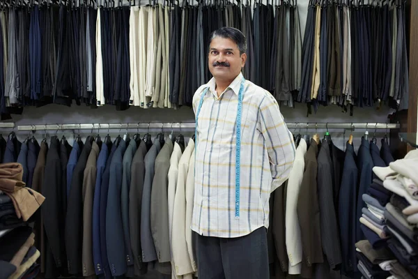 Tailor Standing Shop Front Clothes Racks Portrait — Stock Photo, Image