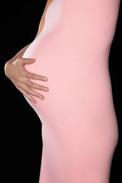 Pregnant Woman Body Suit Holding Abdomen Mid Section Side View — Stock Photo, Image