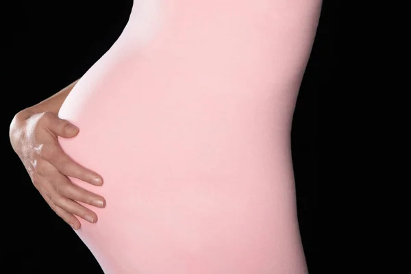 Pregnant Woman Body Suit Holding Abdomen Mid Section Side View — Stock Photo, Image