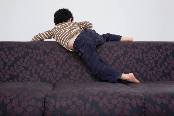 Boy Climbing Sofa — Stock Photo, Image