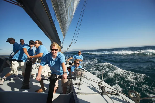 Sailing team on yacht