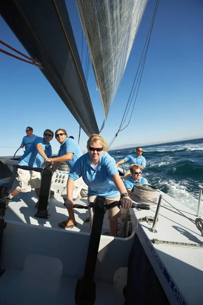 Sailing team on yacht