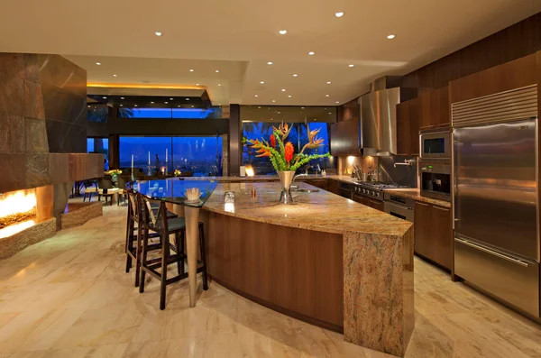 Contemporary kitchen of manor house under lights
