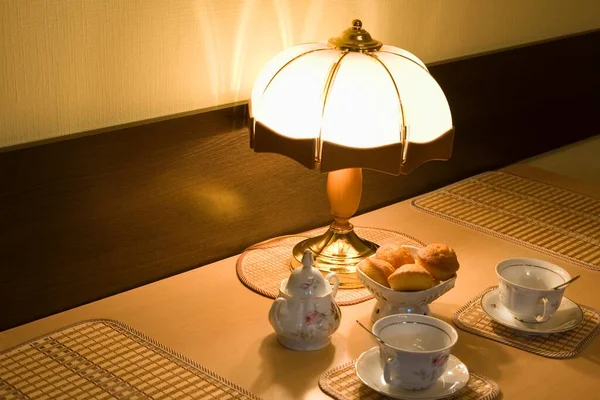 Lit Lamp Teacups Scones — Stock Photo, Image