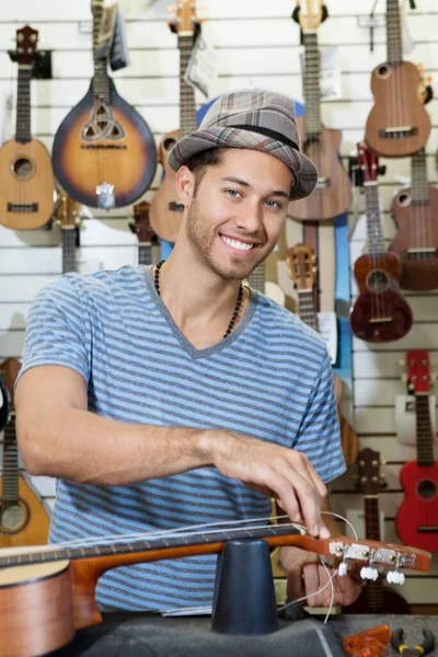 Portrait Happy Owner Music Store Restringing Guitar — Stock Photo, Image