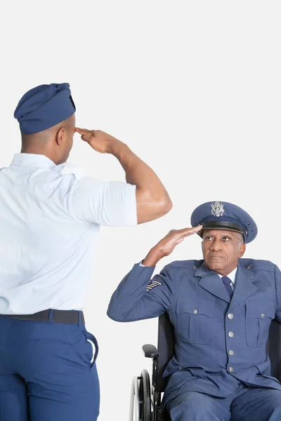 Male Cadet Saluting Senior Air Force Office Wheelchair Light Gray — Stock Photo, Image