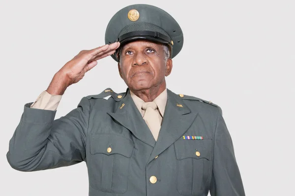 Senior Male Military Officer Saluting Gray Background — Stock Photo, Image