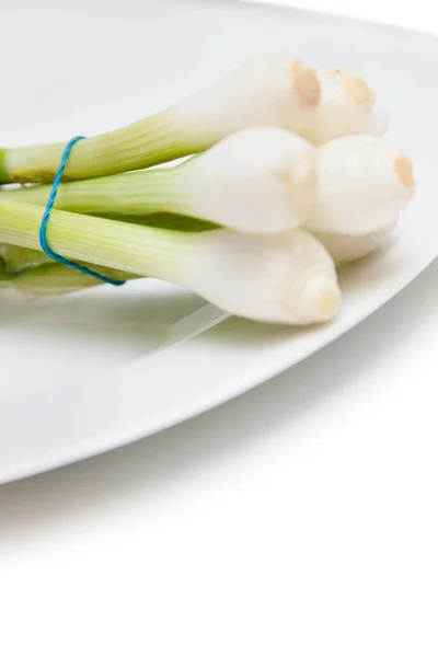 Close Bunch Spring Onions Plate White Background — Stock Photo, Image