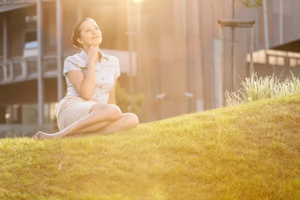 Thoughtful Young Businesswoman Relaxing Office Lawn — Stock Photo, Image