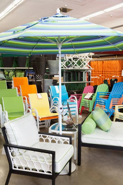 Seating furniture and patio umbrella for sale in garden furniture store