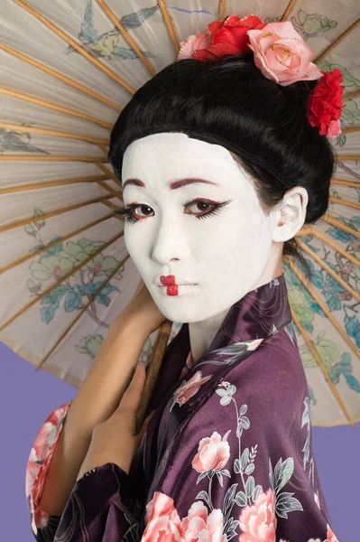 Close Japanese Woman Painted Face Holding Parasol Purple Background — Stock Photo, Image