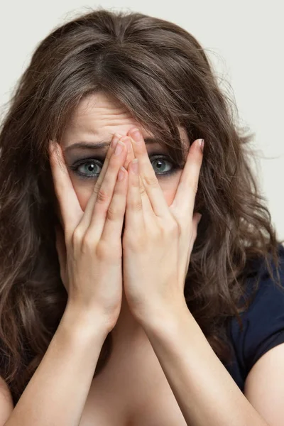 Close Portrait Frightened Young Woman Hands Face Gray Background — Stock Photo, Image