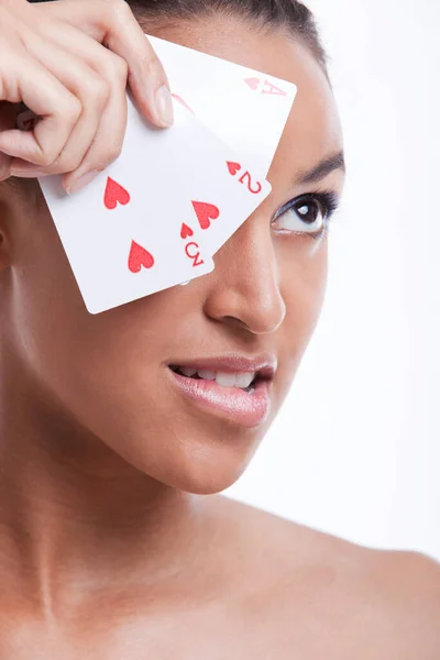 Portrait Young Mixed Race Woman Playing Cards Biting Her Lip — Stock Photo, Image