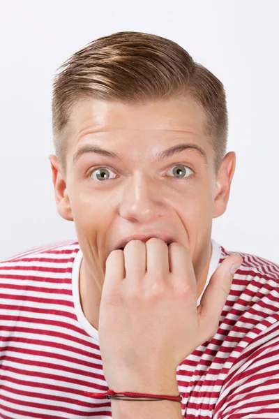 Retrato Jovem Espantado Mordendo Dedo Sobre Fundo Branco — Fotografia de Stock