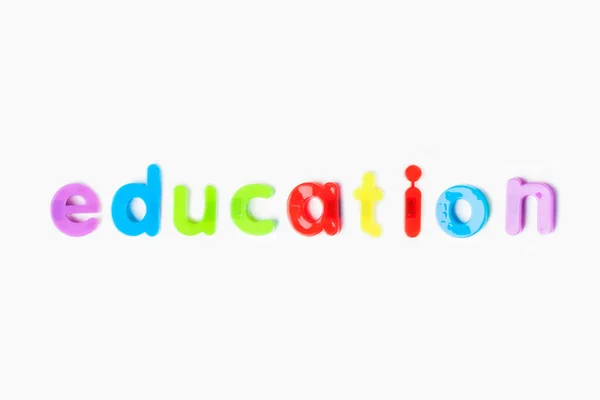 Onderwijs Gespeld Met Kleurrijke Alfabet Magneten Witte Achtergrond — Stockfoto