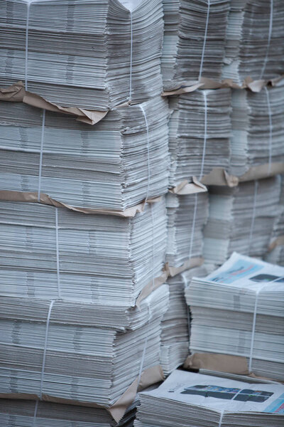 Stack of newspapers on background, close up