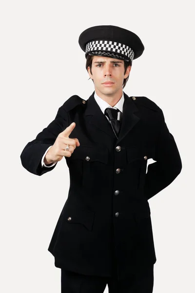 Portrait Confident Police Officer Gesturing Gray Background — Stock Photo, Image