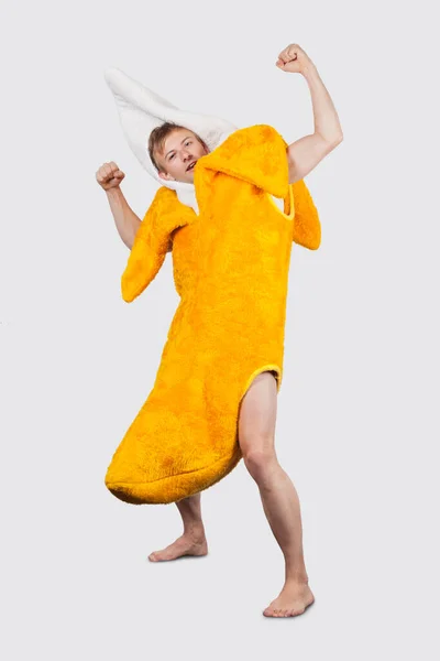 Portrait Young Man Banana Costume Flexing Muscle Gray Background — Stock Photo, Image